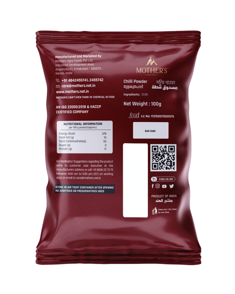 Back of Mother’s Red Chilli Powder pack displaying ingredients as pure chilli along with certified manufacturing standards and FSSAI license details.